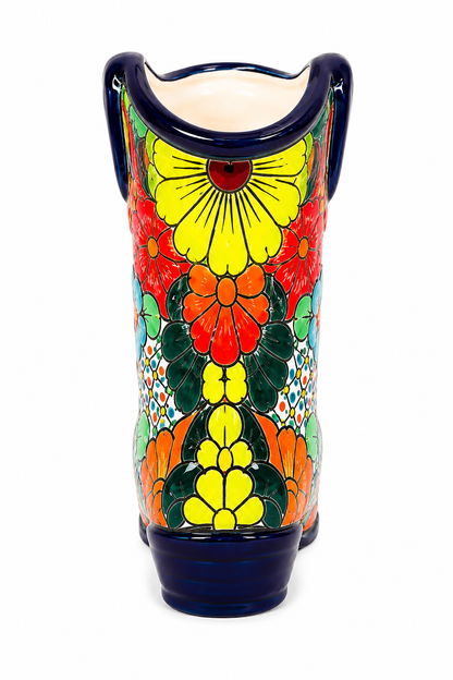 Colorful ceramic vase with floral patterns on a white background