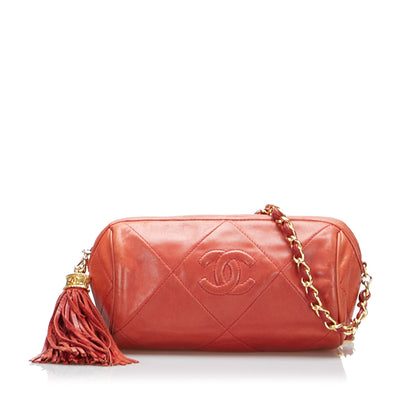 Chanel sac à bandoulière rond rouge matelassé à franges et pompons