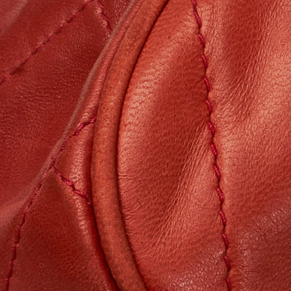 Chanel sac à bandoulière rond rouge matelassé à franges et pompons