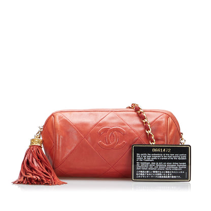 Chanel sac à bandoulière rond rouge matelassé à franges et pompons