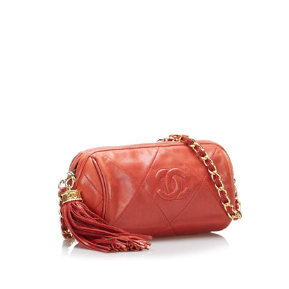 Chanel sac à bandoulière rond rouge matelassé à franges et pompons