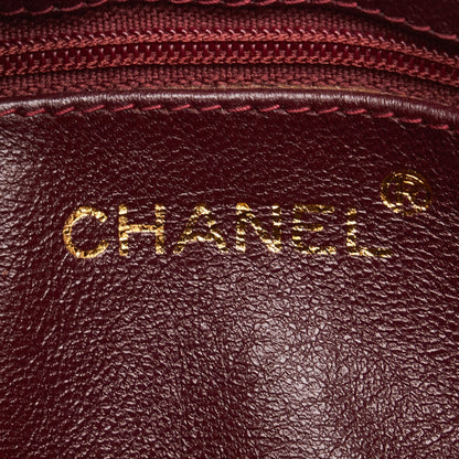 Chanel sac à bandoulière rond rouge matelassé à franges et pompons