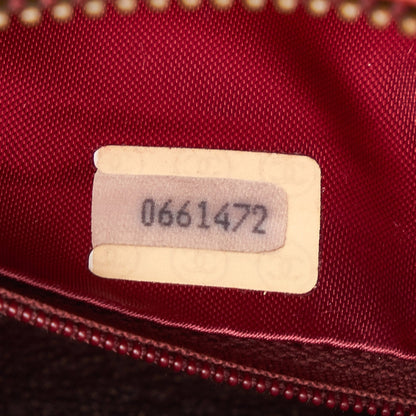 Chanel sac à bandoulière rond rouge matelassé à franges et pompons