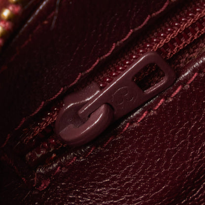 Chanel sac à bandoulière rond rouge matelassé à franges et pompons
