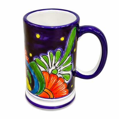 Colorful ceramic mug with floral design on a white background