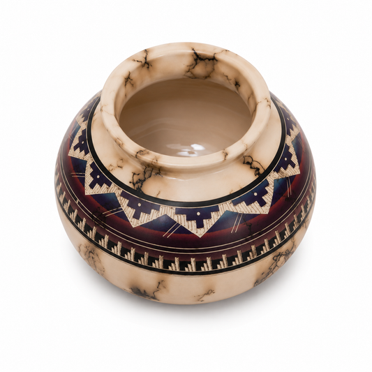 Decorative ceramic bowl with geometric patterns on a white background