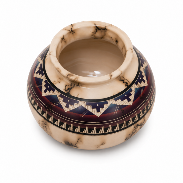Decorative ceramic bowl with geometric patterns on a white background