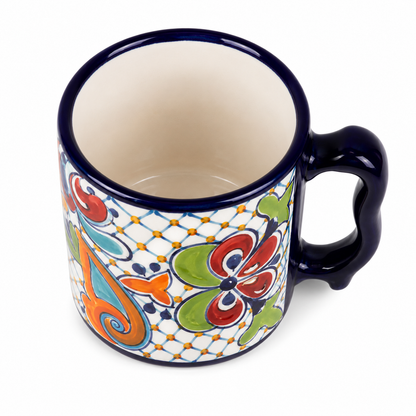 Colorful ceramic mug with decorative patterns on a white background