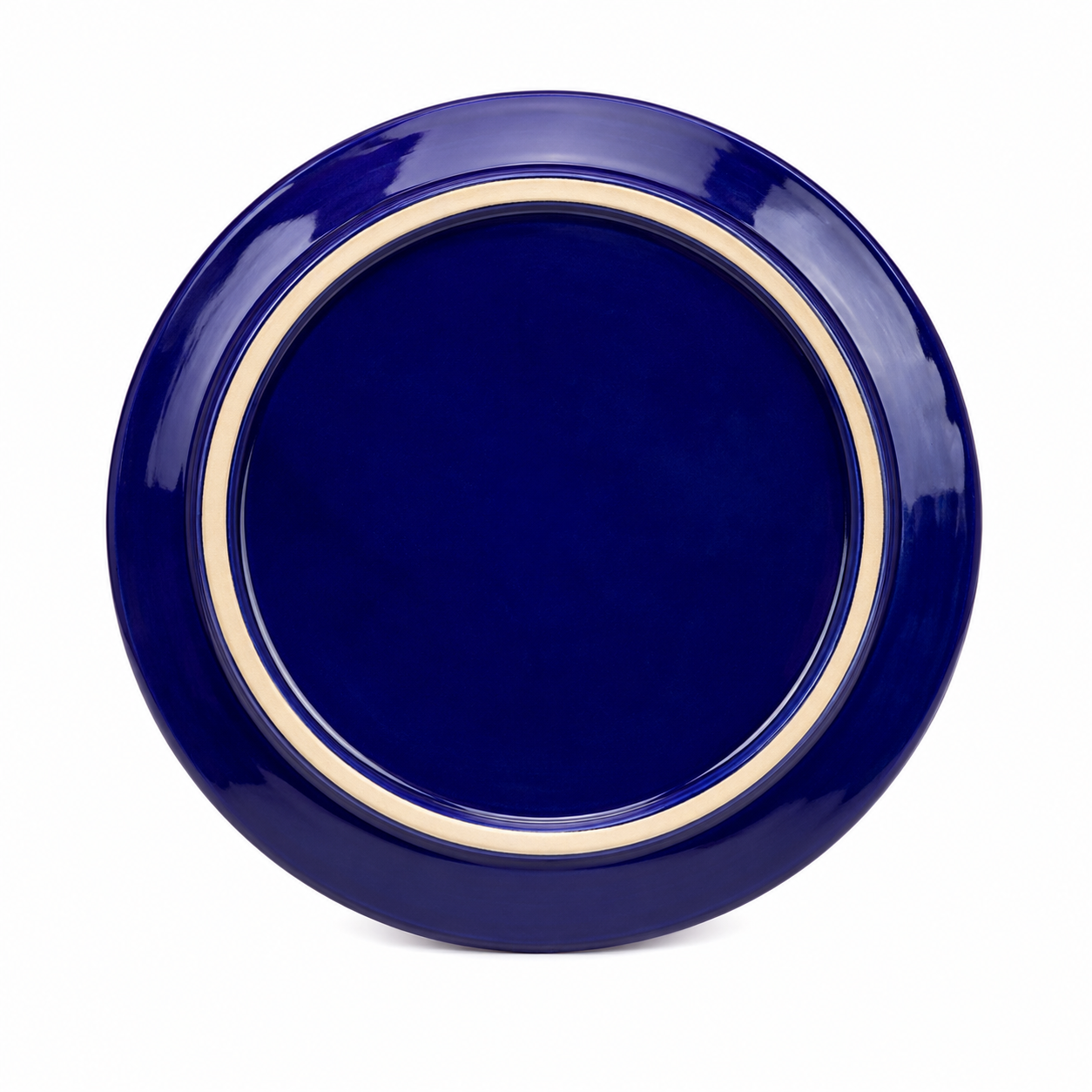 Navy blue plate with a beige rim on a white background