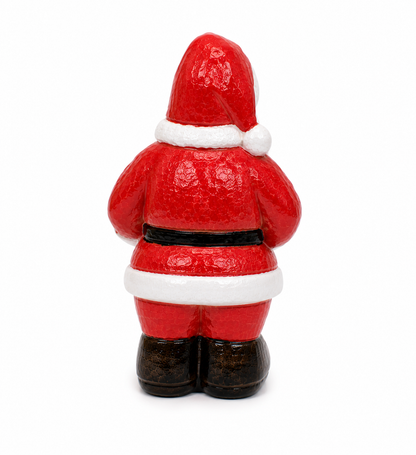 Back view of a red Santa Claus figurine on a white background